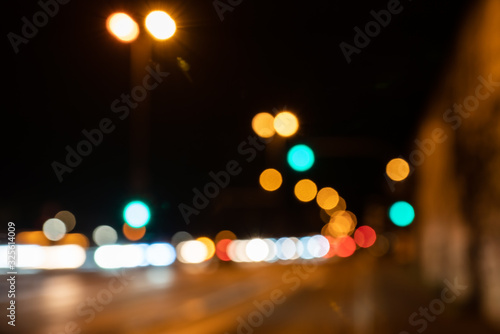 Blurred city lights of an intersection at night