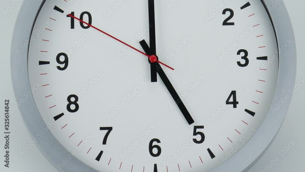 Move the camera angle from Bottom to top, Gray watch on White Background, beginning of time 05.00 am or pm, Clock Red second hand minute Walk slowly, Time concept. Move the camera angle from Bottom to top, Gray watch on White Background, beginning of time 05.00 am or pm, Clock Red second hand minute Walk slowly, Time concept.