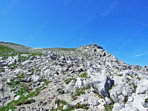 Alpine mountain peak Augstenberg over the Malbuntal alpine valley and in the Liechtenstein Alps mountain range - Malbun, Liechtenstein photo