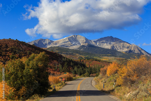 Scenic mountain road in the Maroon Bells-Snowmass Wilderness of the White River National Forest with views of Mt. Sopris 