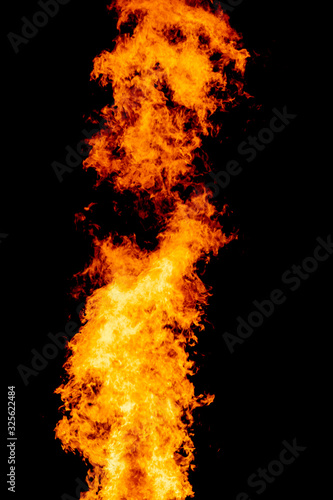 Yellow red and orange fire flames blazing fiery burning isolated on a black background