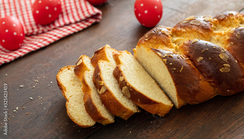 Easter greek tsoureki braid, sweet bread brioche on wood photo