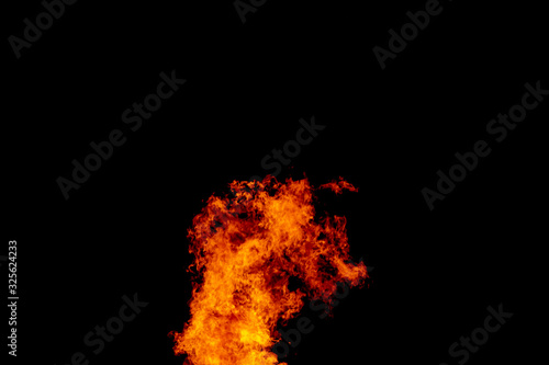 Yellow red and orange fire flames blazing fiery burning isolated on a black background © 168 Studio