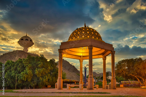 Gazebo Dome bathed in Golden light along with the Frankincense burner monument in the evening. From Muscat, Oman.