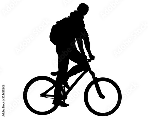 Young athlete on a bike for extreme stunts. Isolated silhouette on a white background