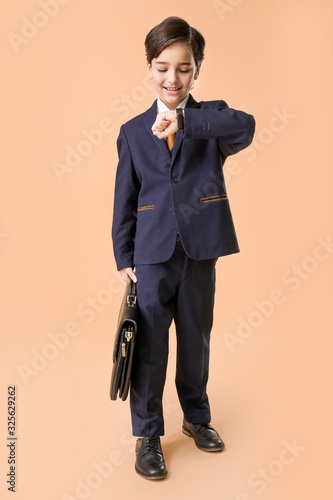 Little businessman looking ...