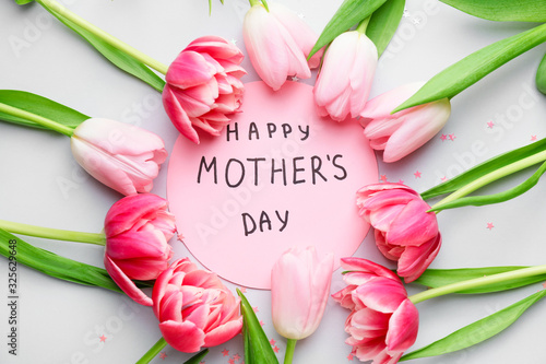 Beautiful flowers and card for Mother's Day on white background
