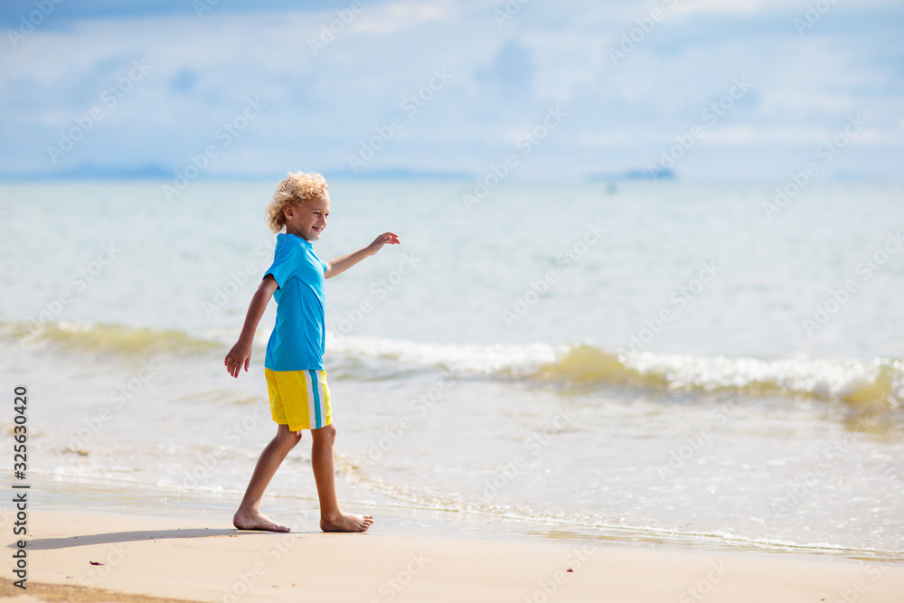 Kids playing on beach. Children play at sea. Kids playing on beach. Children play at sea.