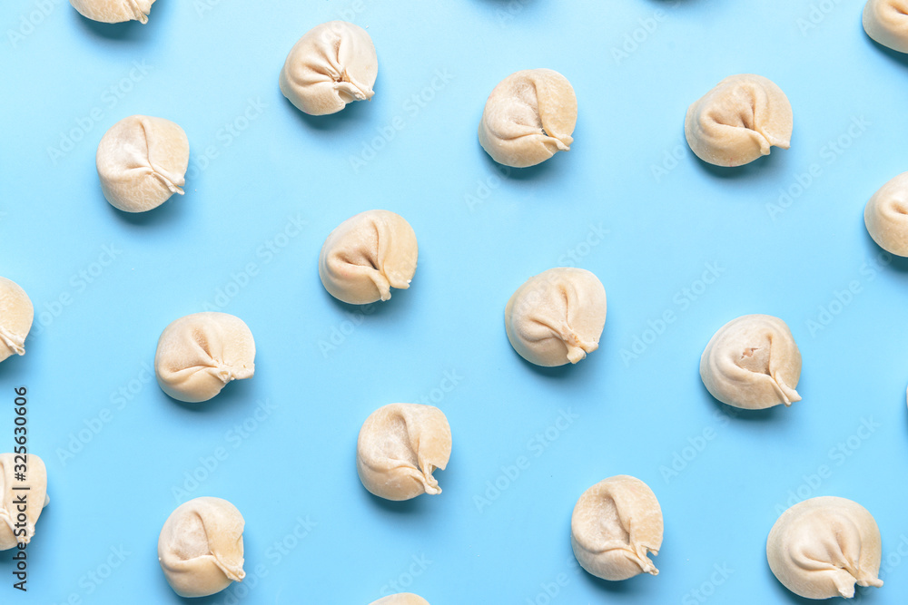 Raw fresh dumplings on color background Raw fresh dumplings on color background
