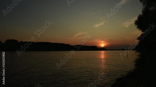 Timelapse of a beautiful sunset on a Danube river photo