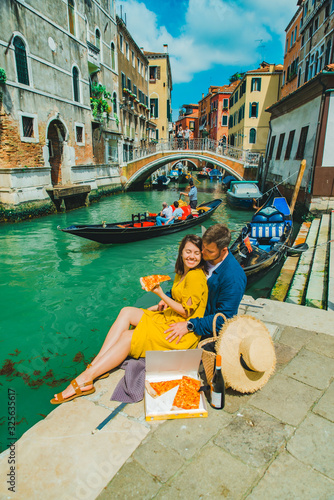 couple having date at pier with beautiful view of venice canal © phpetrunina14