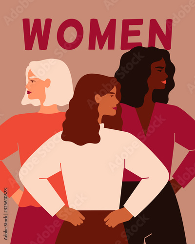 Three women of different nationalities standing together. Women's friendship, union of feminists or sisterhood. The concept of the female's empowerment movement.