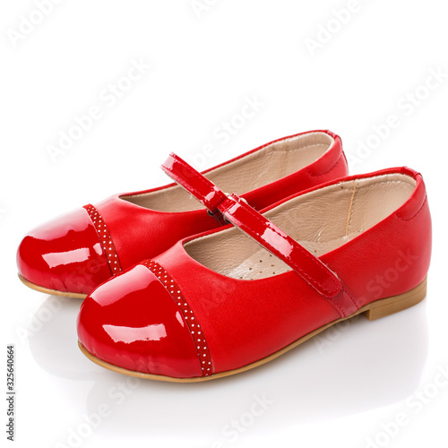 Children's red leather shoes for girls. isolated on white. Side view