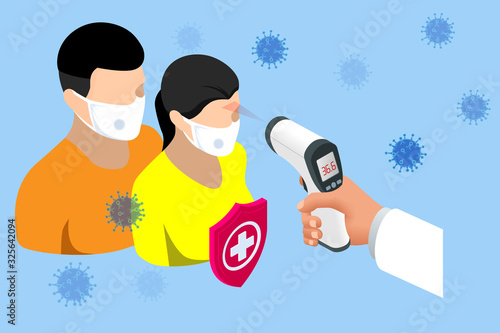 A doctor measures the temperature of a woman in a medical mask. Novel Wuhan coronavirus 2019-nCoV epidemic outbreak. Medical Digital Non-Contact Infrared Thermometer, covid-19 checkpoint