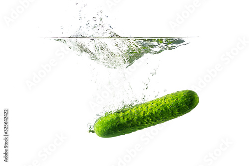 Cucumber with spray isolated on white.
