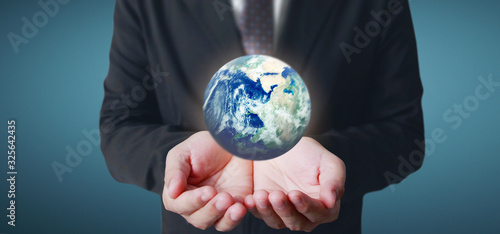 Globe  earth in human hand. Earth image provided by Nasa