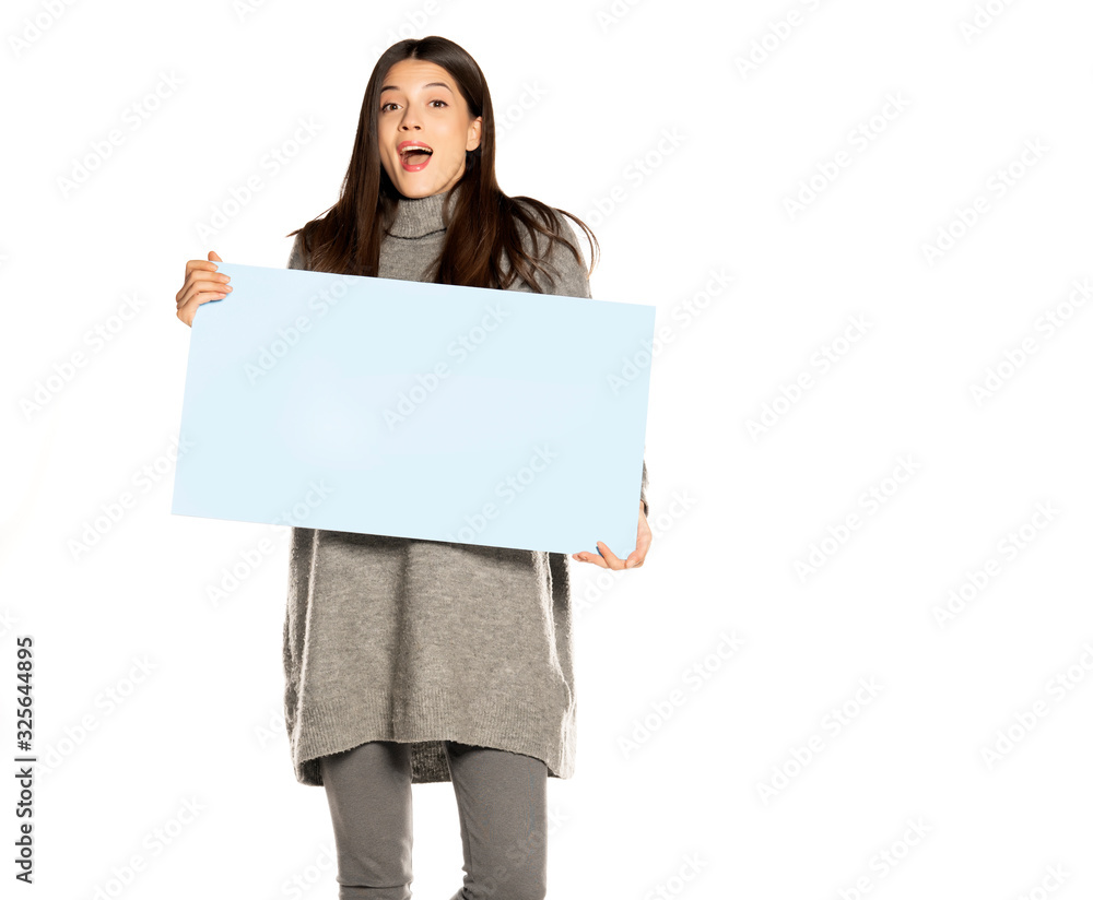 young beautiful happy woman holding a blue empty board on white young beautiful happy woman holding a blue empty board on white