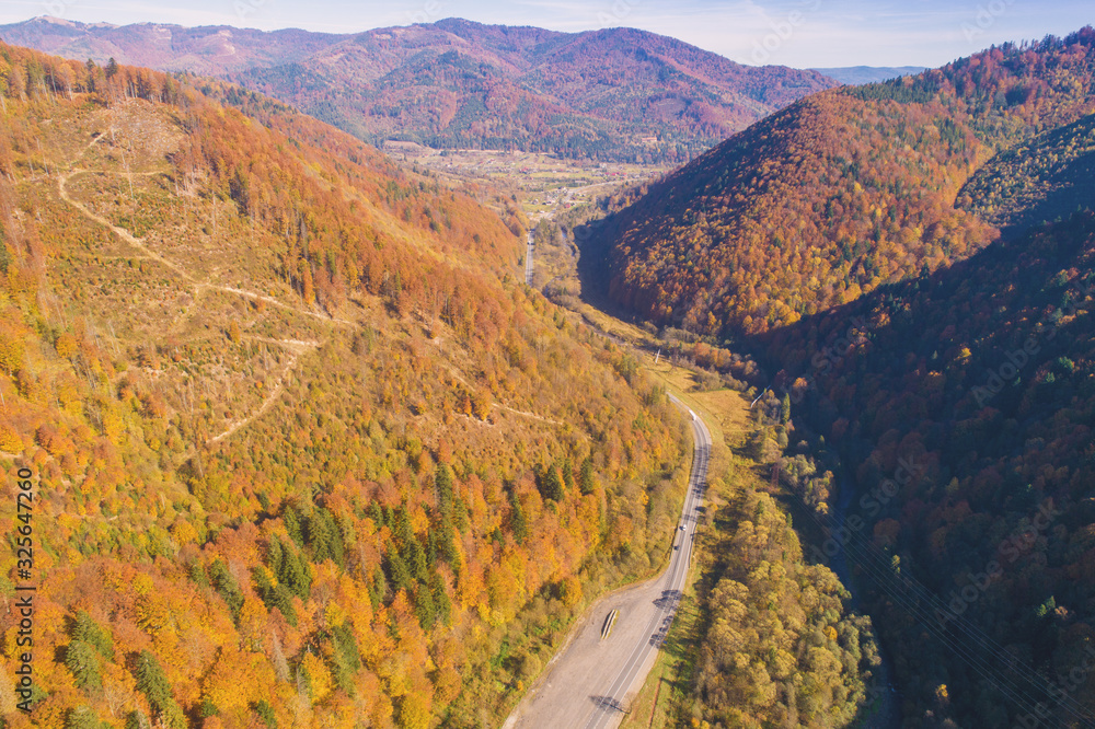Beautiful autumn mountain landscape. Highway among the mountains. View from above