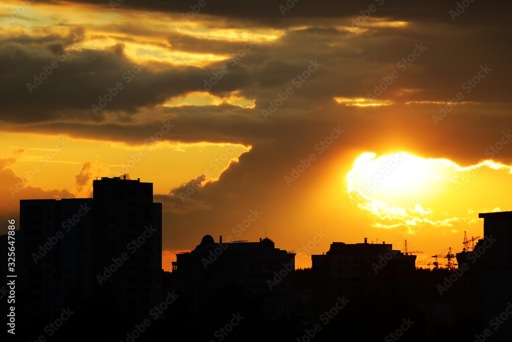 Sunrise at the city. Silhouette of buildings.