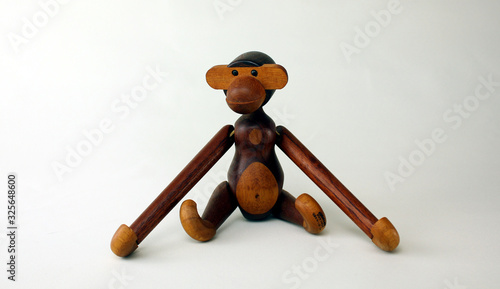 Photography Oslo, Norway – February 24th ,2020: Vintage wood monkey figurine on white backgr