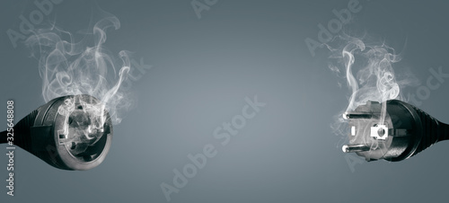 Canvas Print Technical difficulties concept - smoking electric plug and socket