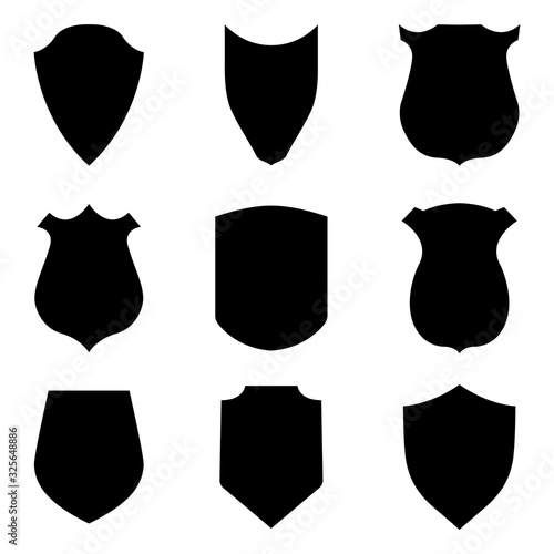 Black shield emblems isolated on white background. Security and police labels. Insignia, awards militaries. Symbol and crest of safety for guards coats. Medieval heraldic style. Blank badges. Vector
