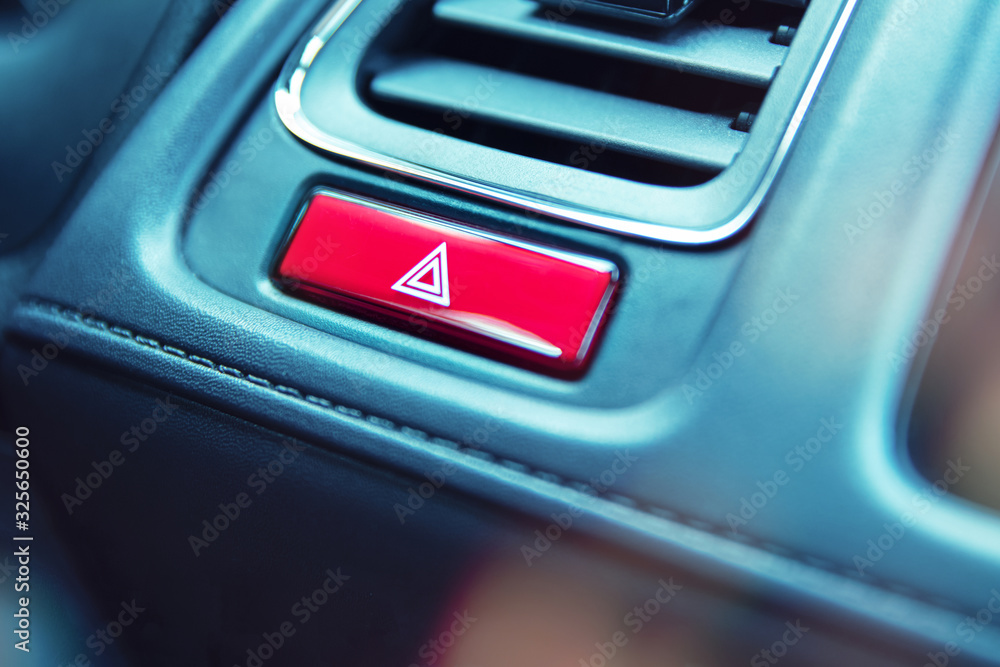 Close-up to emergency light button in car
