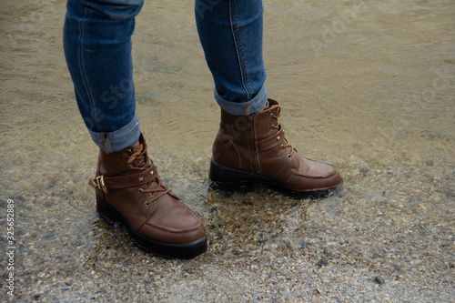 Girl in wet clothes by the sea