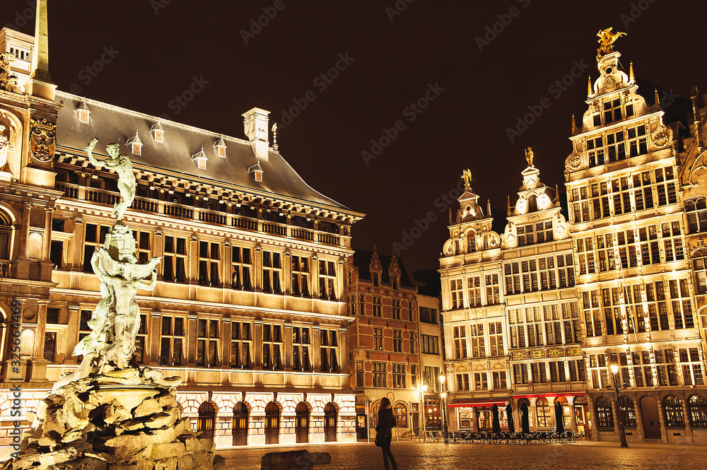Night landscape of main market square in Antwerp, Belgium with a lot of lights on guildhouses and other buildings. Antwerpen famous popular tourist travel destination