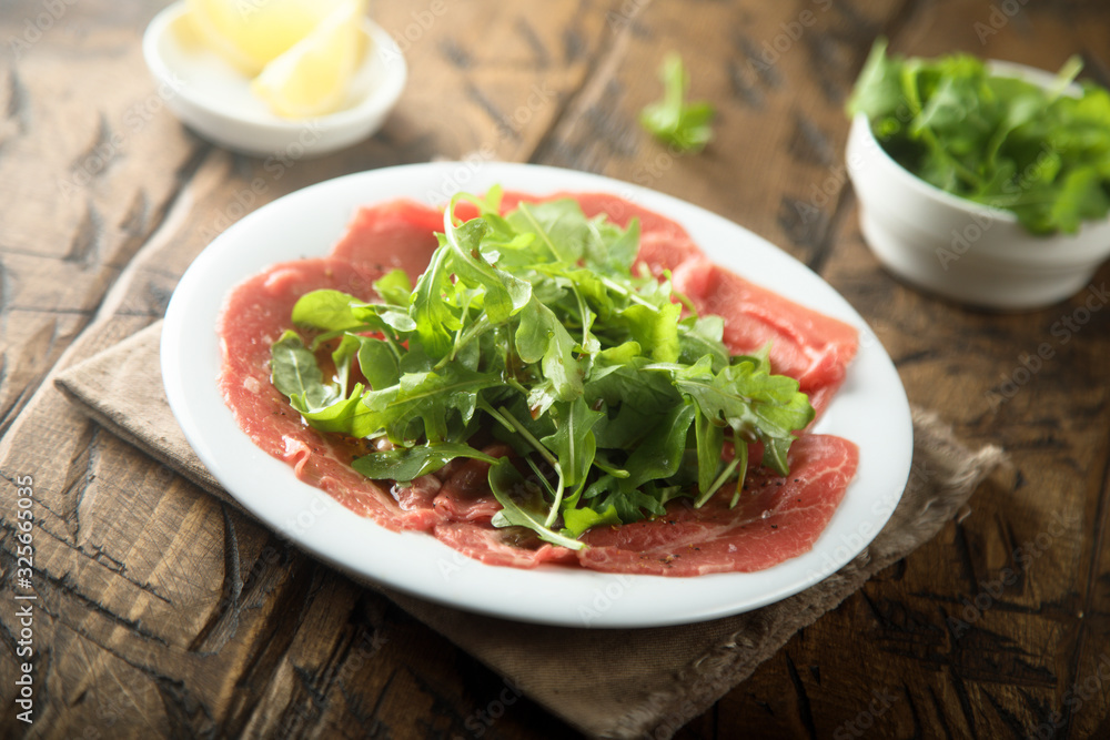 Beef carpaccio with fresh arugula salad Beef carpaccio with fresh arugula salad
