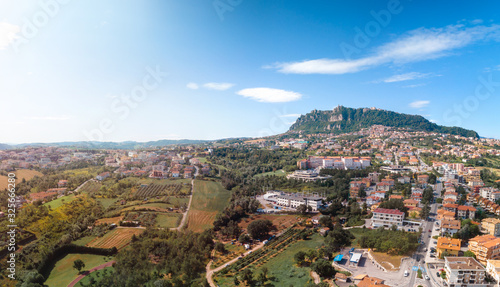 Aerial landscape view from distance on main city rock of San Marino Republic in the background. The concept of the best places for tourism and journey. Down town, Italy © Sergey