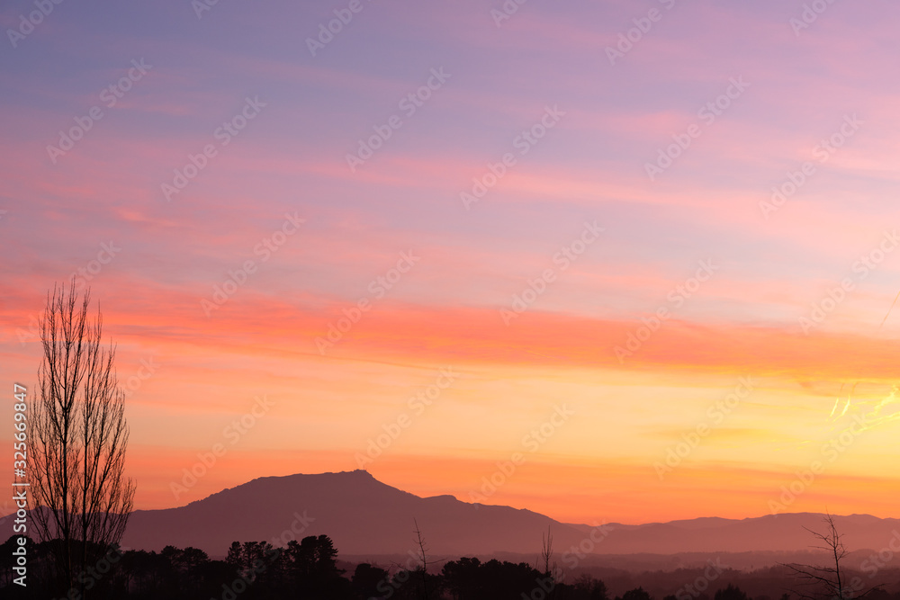 Colorful sunset with a mountain in the background. Basque Country. Colorful sunset with a mountain in the background. Basque Country.