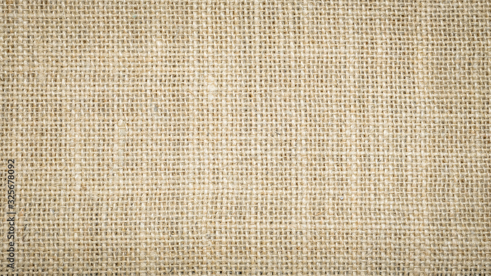 Rough hessian background with flecks of varying colors of beige and brown. with copy space. office desk concept, Hessian sackcloth burlap woven texture background. Rough hessian background with flecks of varying colors of beige and brown. with copy space. office desk concept, Hessian sackcloth burlap woven texture background.