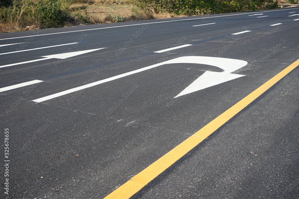 Arrows on asphalt roads and traffic lines in Thailand