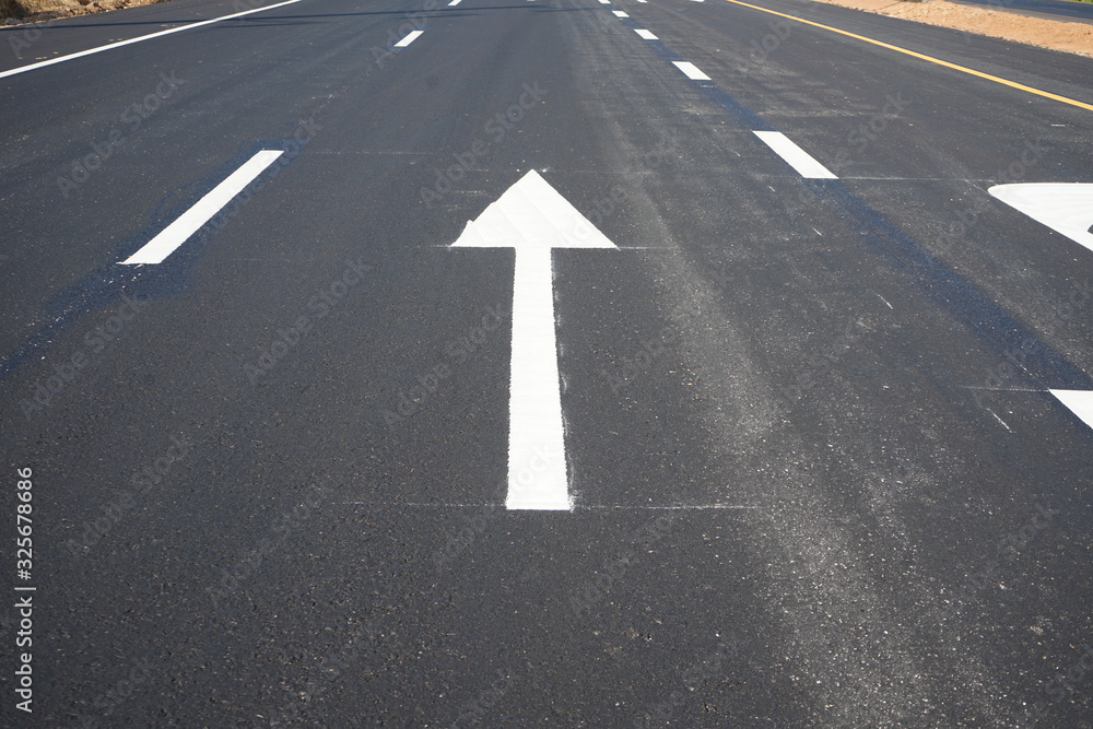 Arrows on asphalt roads and traffic lines in Thailand Arrows on asphalt roads and traffic lines in Thailand