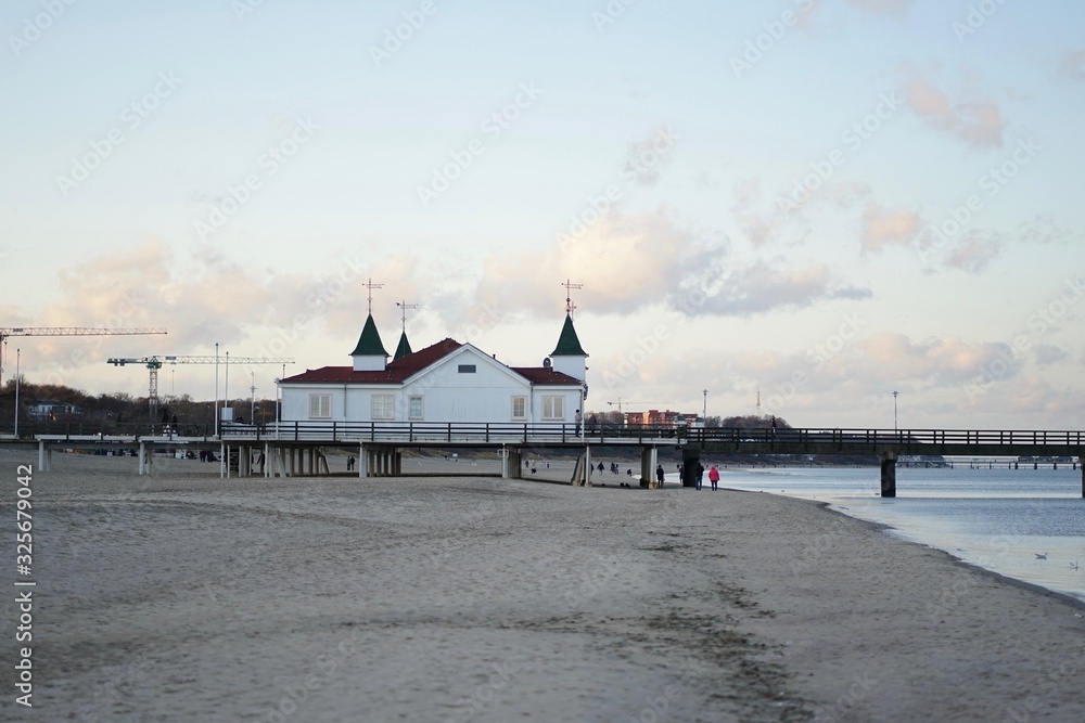 Famous Ahlbeck Sea bridge, pier at baltic sea, Germany at sunset in winter Famous Ahlbeck Sea bridge, pier at baltic sea, Germany at sunset in winter