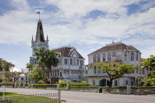 Εκτύπωση καμβά View of an old wooden fairy-tale Gothic building with spires and turrets on a clear Sunny day, the city hall of Georgetown, Guyana