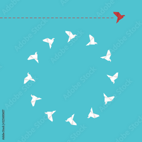 Think differently concept. Be different. Red bird changing direction. New idea, change, trend, courage, creative solution, innovation and unique way concept.	