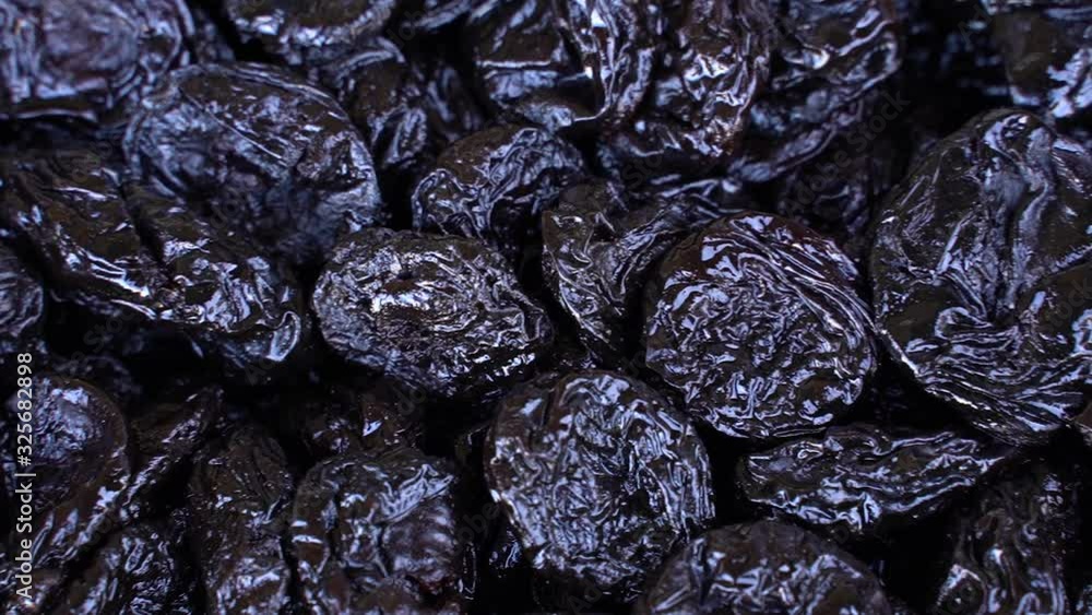 Background of delicious dried plums (prunes). Texture of food. Close up. Background of delicious dried plums (prunes). Texture of food. Close up.