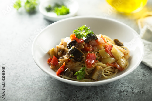 Spaghetti with vegetable ragout and fresh parsley
