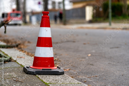 traffic cones on the road, red white with a blurred background 