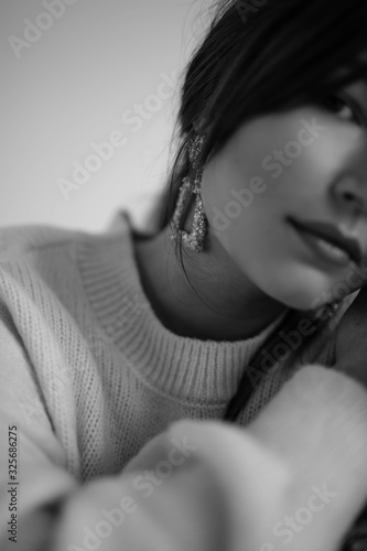  black and white portrait of a young girl with massive earrings