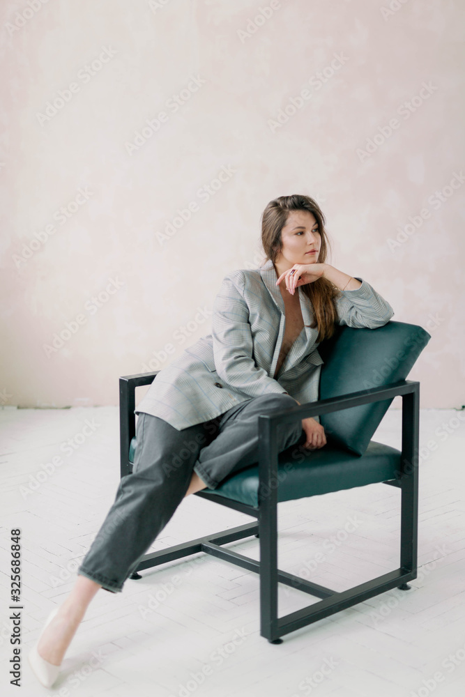 business woman sitting on a chair business woman sitting on a chair