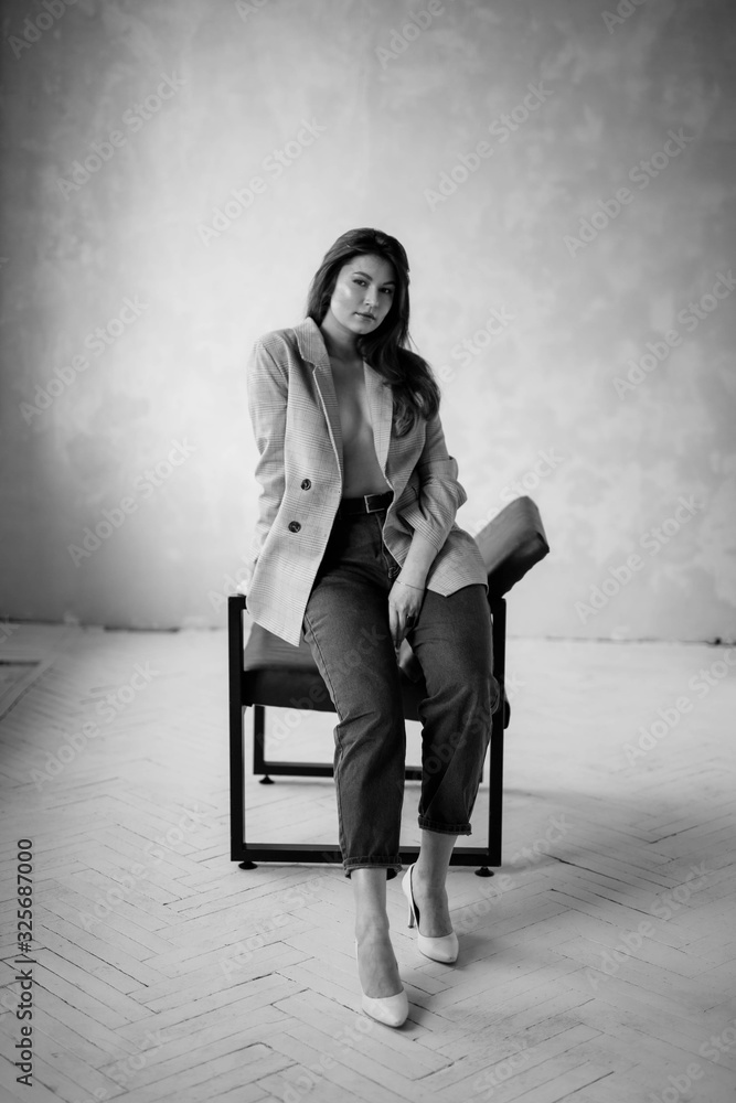 Obraz premium young bussineswoman sitting on a chair