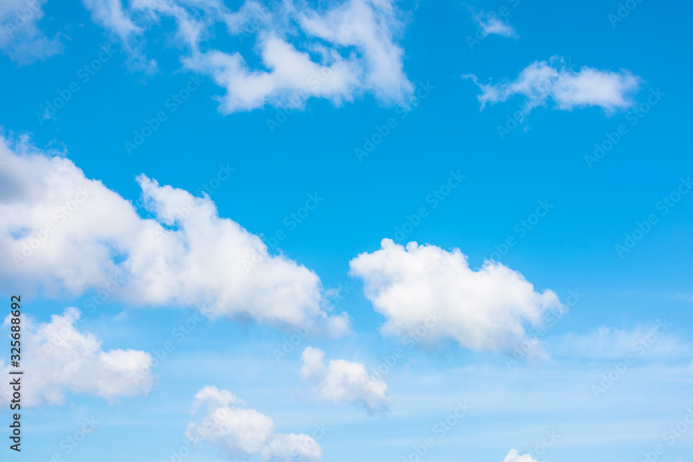 Fototapeta premium gorgeous cloudscape in springtime. weather background with dynamic cloud arrangement on a blue sky. sunny and windy day, good weather forecast concept