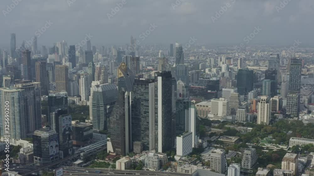 Bangkok Thailand Aerial v172 Flying low around Pathum Wan district with full downtown cityscape Ratchathewi views - January 2020 Bangkok Thailand Aerial v172 Flying low around Pathum Wan district with full downtown cityscape Ratchathewi views - January 2020