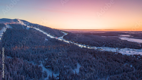 Fotografie The ski slopes of Levi ski resort at sunrise, Kittilä, Finland