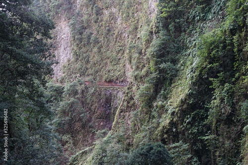 Verlauf der Levada da Ribeira da Janela an einer Felswand photo