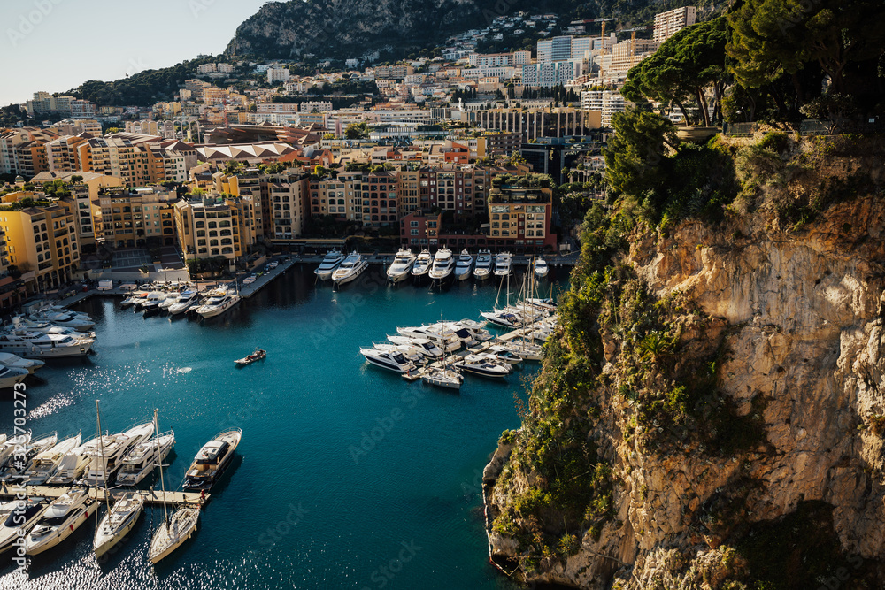 Visible marina in Monaco. Luxury yachts. Cityscape, French Riviera. Panorama. Panoramic view of port in Monaco. Azur coast. Colorful bay with a lot of luxury yachts.
