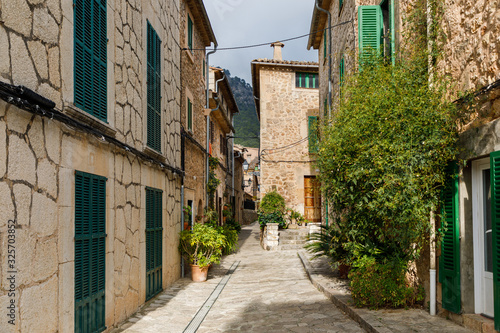 The street with flower pots in Valldemossa town © castenoid